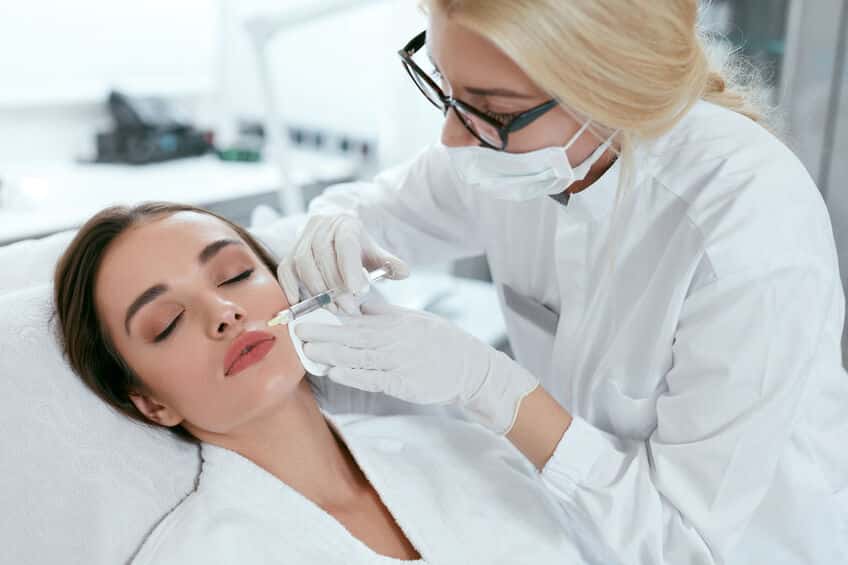 beauty injections. woman getting face lifting procedure closeup